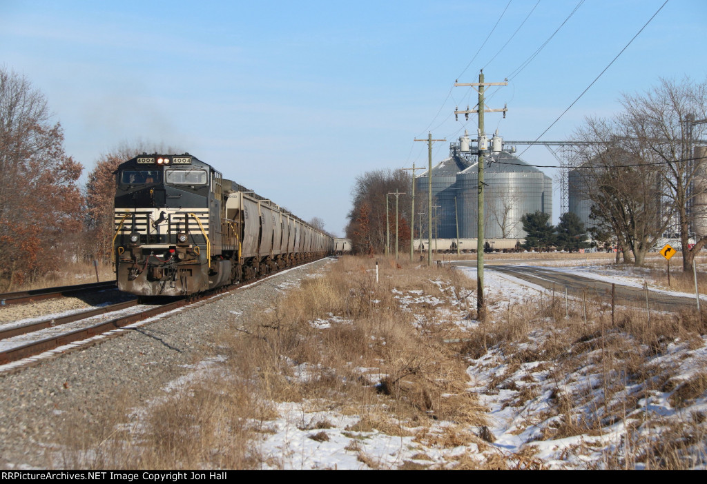As the conductor starts the air test, another loaded grain train for the Andersons waits to go south